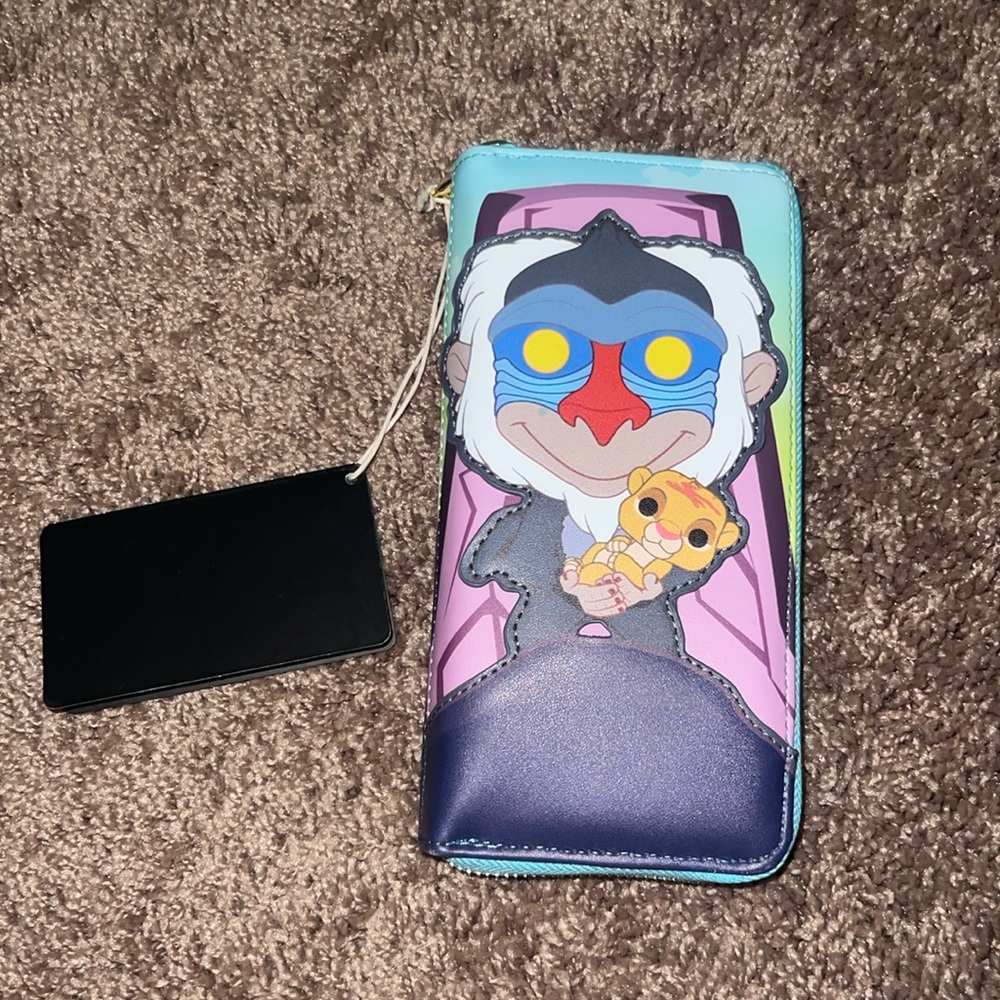 New with tags The Lion King Loungefly wallet.